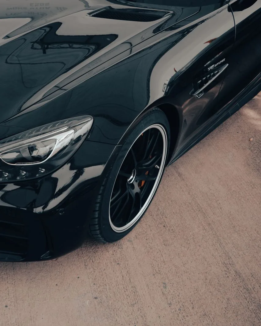 Glossy black Mercedes-AMG with deep, mirror-like reflections after ceramic coating