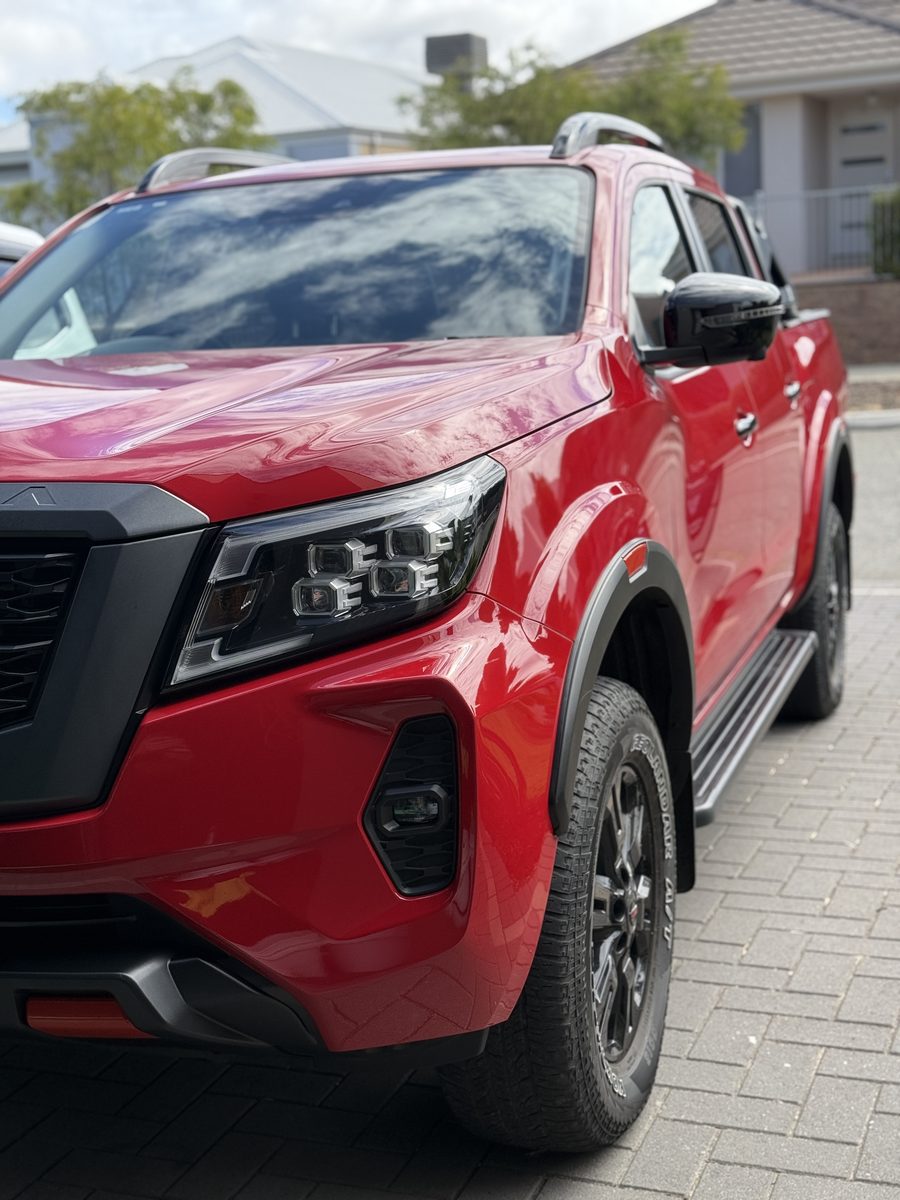 Deep mirror gloss and crisp reflections in a freshly detailed bonnet